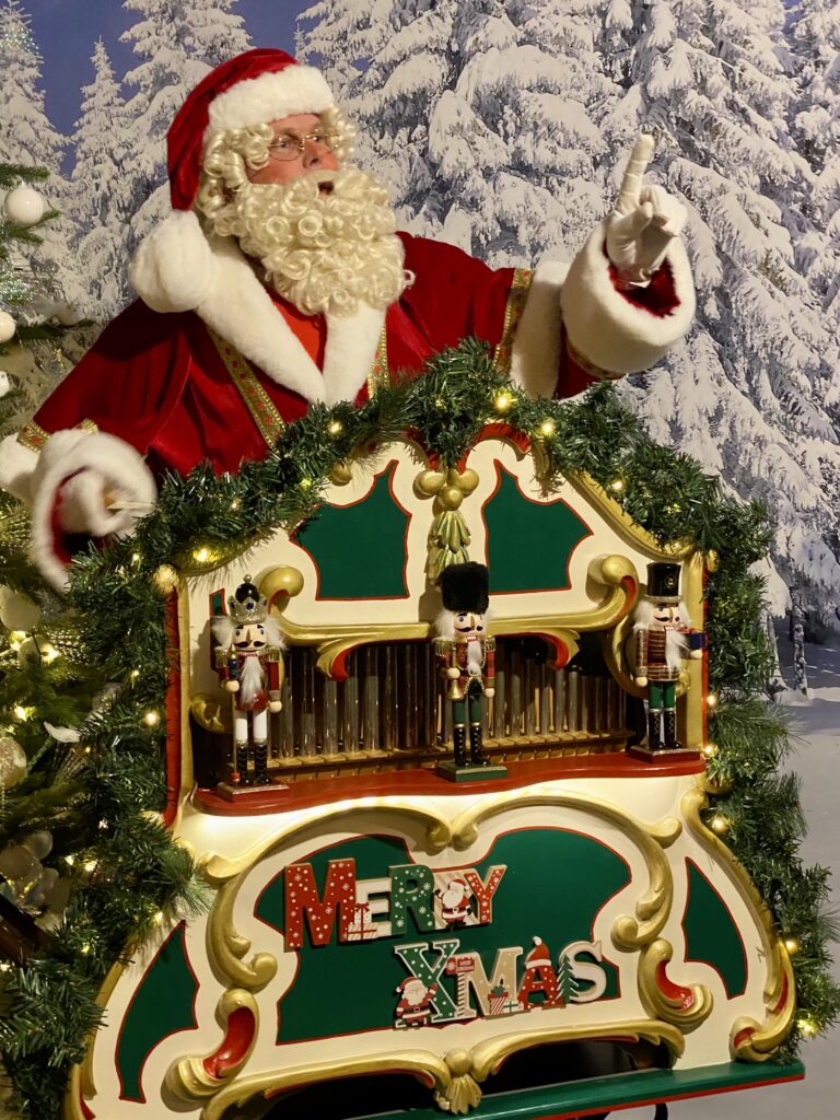 Kerstman met kerstorgeltje draaiorgel kerstmuziek huren